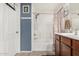 Clean bathroom with a shower-tub combination, white fixtures and modern finishes, offering a refreshing and bright space at 2048 S Martingale Rd, Gilbert, AZ 85295