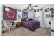 Bright and inviting bedroom with unique décor, a ceiling fan, and comfortable furnishings, perfect for relaxation and rest at 2048 S Martingale Rd, Gilbert, AZ 85295