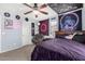 Stylish bedroom featuring eclectic decor, a ceiling fan, and comfortable seating at 2048 S Martingale Rd, Gilbert, AZ 85295