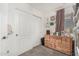 Cozy bedroom corner featuring a wood dresser and closet with double doors at 2048 S Martingale Rd, Gilbert, AZ 85295