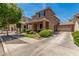 Lovely two-story house showcasing a covered porch, a two car garage and well-maintained front yard at 2048 S Martingale Rd, Gilbert, AZ 85295