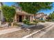Beautiful two-story home with a cozy front porch, complemented by lush greenery and a manicured lawn at 2048 S Martingale Rd, Gilbert, AZ 85295