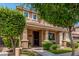 Charming residence featuring a welcoming front porch, neat landscaping, and an inviting curb appeal at 2048 S Martingale Rd, Gilbert, AZ 85295