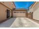 Attached two-car garage with a clean, extended driveway at 2048 S Martingale Rd, Gilbert, AZ 85295