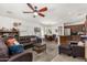 Open-concept living room features a comfortable sofa, dining area, and kitchen access at 2048 S Martingale Rd, Gilbert, AZ 85295