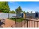 Enclosed backyard with secure fencing, brick patio, and ample space for outdoor activities and leisure at 2114 E Sesame St, Tempe, AZ 85283
