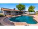 Inviting backyard with a refreshing pool and lush landscaping, perfect for outdoor relaxation at 2114 E Sesame St, Tempe, AZ 85283