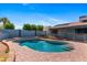 Beautiful backyard oasis with a sparkling pool, spacious patio, and tranquil atmosphere at 2114 E Sesame St, Tempe, AZ 85283