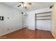 Bedroom with wood laminate flooring and ceiling fan at 2114 E Sesame St, Tempe, AZ 85283