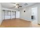 Spacious primary bedroom with ample closet space, ceiling fan, and ensuite bathroom access at 2114 E Sesame St, Tempe, AZ 85283