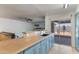Open kitchen with stainless steel appliances, granite countertops, and sliding glass doors to the backyard at 2114 E Sesame St, Tempe, AZ 85283