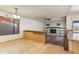 Bright living room featuring tile floors, white brick fireplace, and a ceiling fan at 2114 E Sesame St, Tempe, AZ 85283