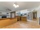 Open-concept living room with tile floors, a view of the kitchen, and natural lighting at 2114 E Sesame St, Tempe, AZ 85283