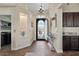 Elegant foyer features dark wood accents, granite countertops, and designer lighting at 22634 N 47Th Pl, Phoenix, AZ 85050