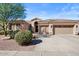 Charming single-story home with a well-manicured yard, three-car garage, and lovely desert landscaping at 22634 N 47Th Pl, Phoenix, AZ 85050