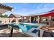 Backyard displaying a pool, outdoor seating, and mature trees at 22634 N 47Th Pl, Phoenix, AZ 85050
