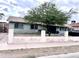 Charming single story home featuring a well-sized yard and large mature tree, complete with a paved walkway at 2310 N 40Th Dr, Phoenix, AZ 85009