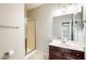 Bathroom with a glass-enclosed shower, vanity with storage, and neutral tile flooring at 2762 E Clifton Ave, Gilbert, AZ 85295