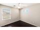This bedroom offers natural light from the window and a ceiling fan at 2762 E Clifton Ave, Gilbert, AZ 85295