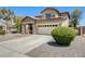 Charming two-story home boasts a stone facade, covered porch, and well-maintained landscaping at 2762 E Clifton Ave, Gilbert, AZ 85295
