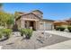 Charming two-story home boasts a stone facade, covered porch, and well-maintained landscaping at 2762 E Clifton Ave, Gilbert, AZ 85295