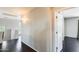 Upstairs hallway with decorative lighting, wood floors and views from nearby windows at 2762 E Clifton Ave, Gilbert, AZ 85295