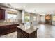 A well-equipped kitchen features custom cabinets, granite counters, stainless steel appliances, and backyard views at 2762 E Clifton Ave, Gilbert, AZ 85295