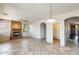The living room features tile flooring, a decorative light fixture, and a hallway at 2762 E Clifton Ave, Gilbert, AZ 85295