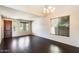 Spacious living room featuring dark wood floors, neutral walls, and natural light from windows at 2762 E Clifton Ave, Gilbert, AZ 85295