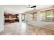 Open-concept living space featuring tile flooring, a kitchen, and access to the patio at 2762 E Clifton Ave, Gilbert, AZ 85295