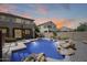 Inviting backyard pool with rock features and desert landscaping in a residential neighborhood at 2762 E Clifton Ave, Gilbert, AZ 85295