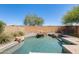 Sparkling pool with rock accents and mature landscaping, offering a serene and private backyard retreat at 2762 E Clifton Ave, Gilbert, AZ 85295