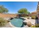 Beautiful pool and backyard including desert landscaping and rock features at 2762 E Clifton Ave, Gilbert, AZ 85295