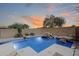 Inviting backyard pool with rock features and desert landscaping, perfect for relaxing and entertaining at 2762 E Clifton Ave, Gilbert, AZ 85295