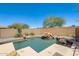Backyard oasis with a pool, desert landscaping, and relaxing rock features at 2762 E Clifton Ave, Gilbert, AZ 85295