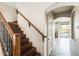 An elegant staircase with wood and iron railings leads to the upper level of the home at 2762 E Clifton Ave, Gilbert, AZ 85295