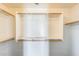 Walk-in closet featuring white shelving and rods for optimal storage at 2762 E Clifton Ave, Gilbert, AZ 85295