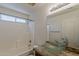 Bathroom featuring a stylish vessel sink, granite countertop, and a shower-tub combination at 28054 N Jade St, San Tan Valley, AZ 85143