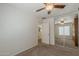 Neutral bedroom offering a mirrored closet, carpet flooring, and access to other rooms in the home at 28054 N Jade St, San Tan Valley, AZ 85143