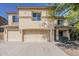 Inviting two-story home featuring a neutral color palette, three-car garage, and well-maintained landscaping at 28054 N Jade St, San Tan Valley, AZ 85143