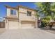 Inviting two-story home featuring a neutral color palette, three-car garage, and well-maintained landscaping at 28054 N Jade St, San Tan Valley, AZ 85143
