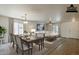 Staged living and dining area showcasing an open layout, neutral tones, and stylish furnishings at 28054 N Jade St, San Tan Valley, AZ 85143