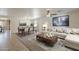 Beautifully staged living and dining area, complete with stylish furnishings and neutral color palettes at 28054 N Jade St, San Tan Valley, AZ 85143