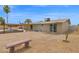 Expansive backyard with a sparkling pool, covered patio, and mature landscaping, offering a perfect blend of comfort and style at 301 N 87Th St, Mesa, AZ 85207