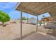 Spacious backyard including open patio and covered area with rock and brick landscaping at 301 N 87Th St, Mesa, AZ 85207