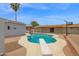 Private backyard oasis with a sparkling pool, spacious patio, and lush greenery, perfect for outdoor entertaining at 301 N 87Th St, Mesa, AZ 85207