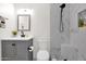 Bathroom featuring modern fixtures, a tiled shower, and stylish vanity at 301 N 87Th St, Mesa, AZ 85207