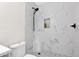 Bathroom featuring modern fixtures, tiled shower, and black shower head at 301 N 87Th St, Mesa, AZ 85207