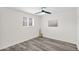 Bright bedroom featuring wood flooring, a window, and artwork on the wall at 301 N 87Th St, Mesa, AZ 85207