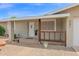Inviting front porch with decorative wood railing, potted plants, and the home's address at 301 N 87Th St, Mesa, AZ 85207